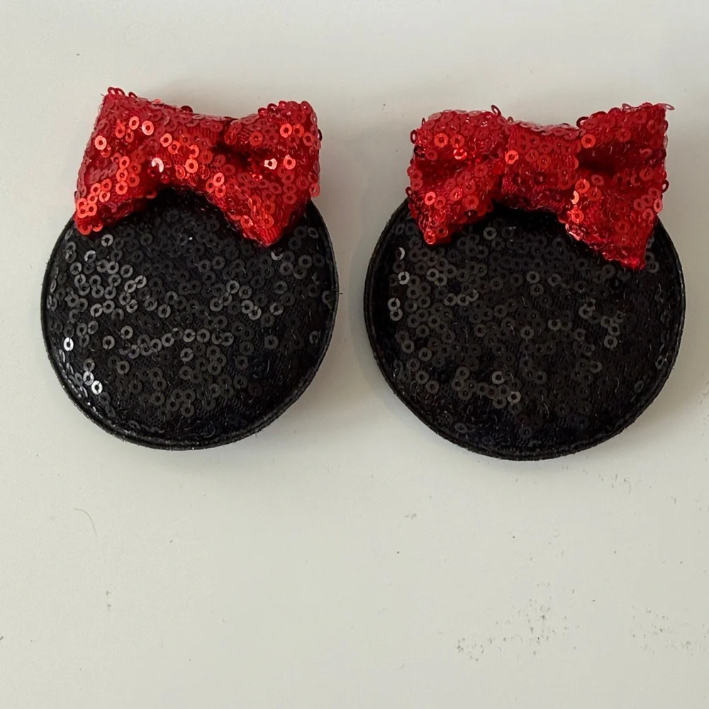 Black MinnieMouse Ear Hair Clips with Red Bows.